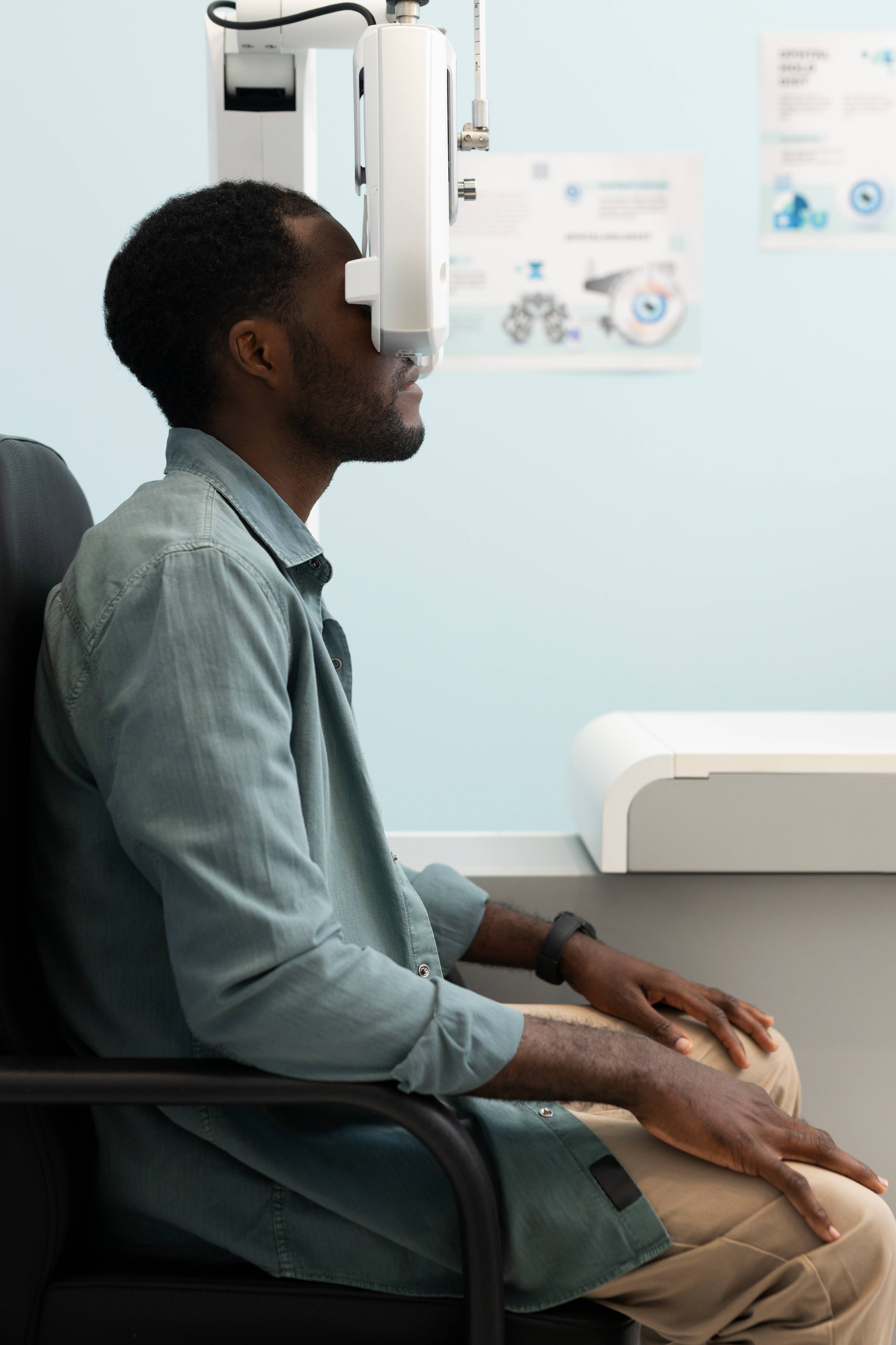 Optometrist examining a patient's eyes with a slit lamp