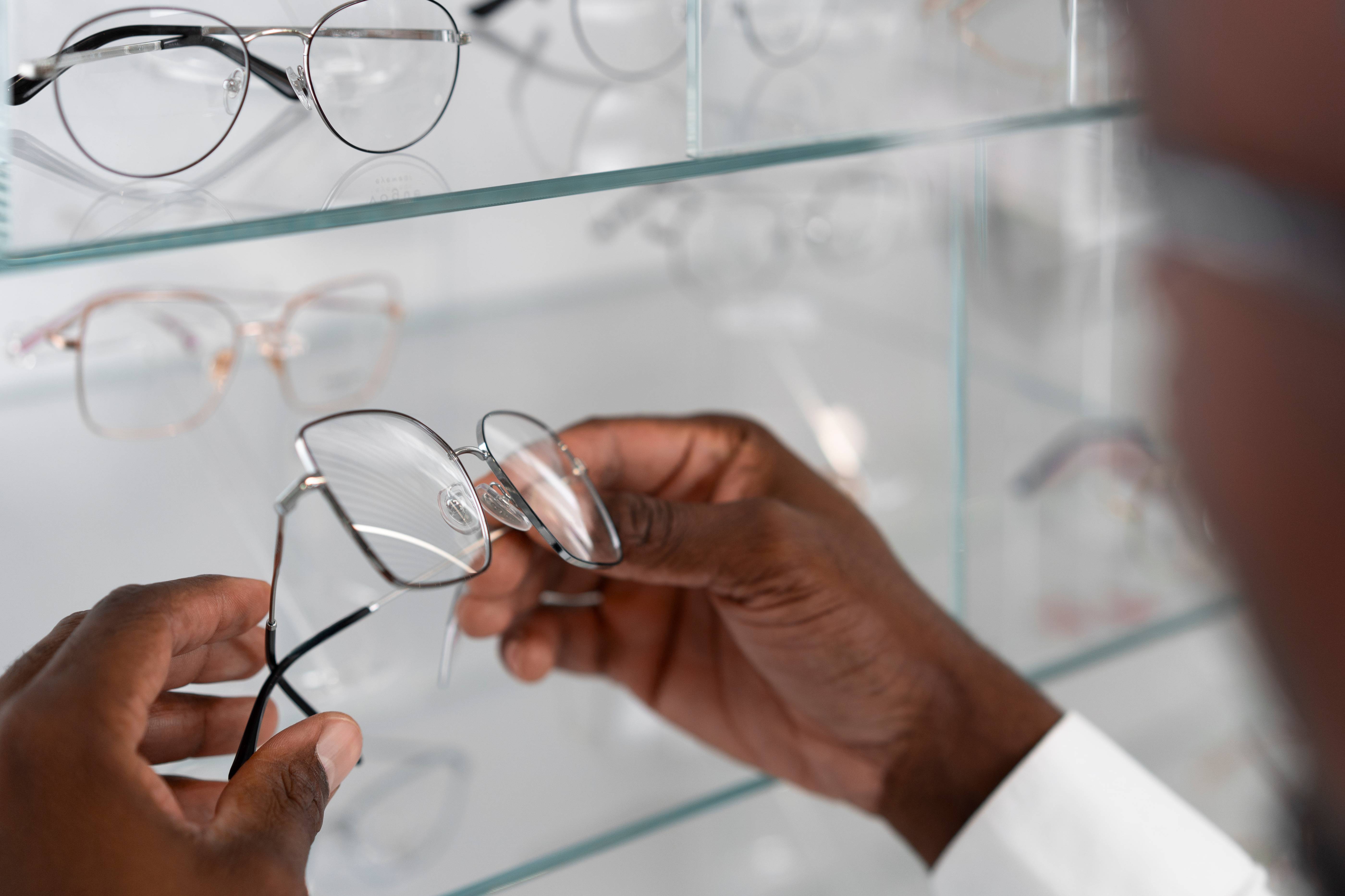Ghanaian woman choosing new spectacle frames